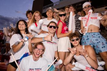 students cheering at a soccer game