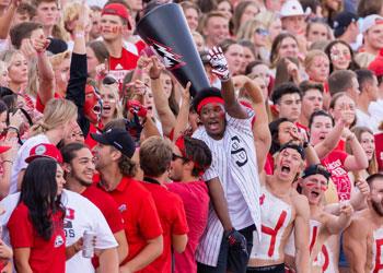 crowd of cheering students at event