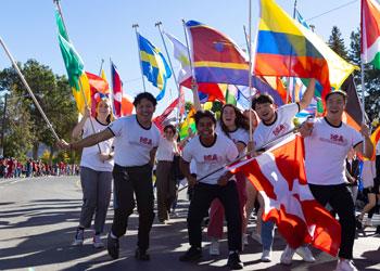 students carrying flags at parade