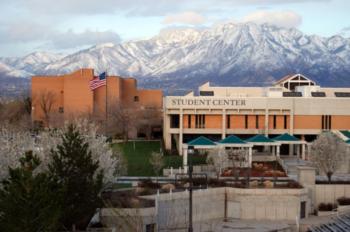 building with 'student center' sign and snowy mountains