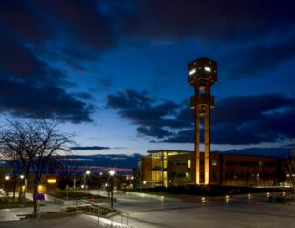 tower lit up at twilight with clear skies